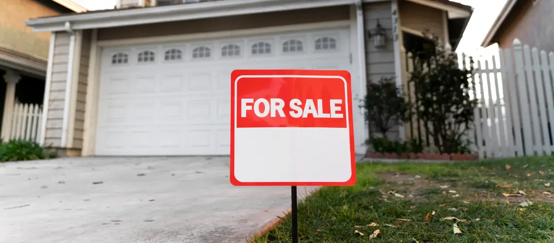 A real estate sign in front of a home for sale in Adelaide during a slow property market